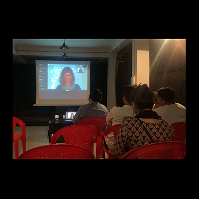 Anna Madill addressing our impact event audience in Assam through Skype